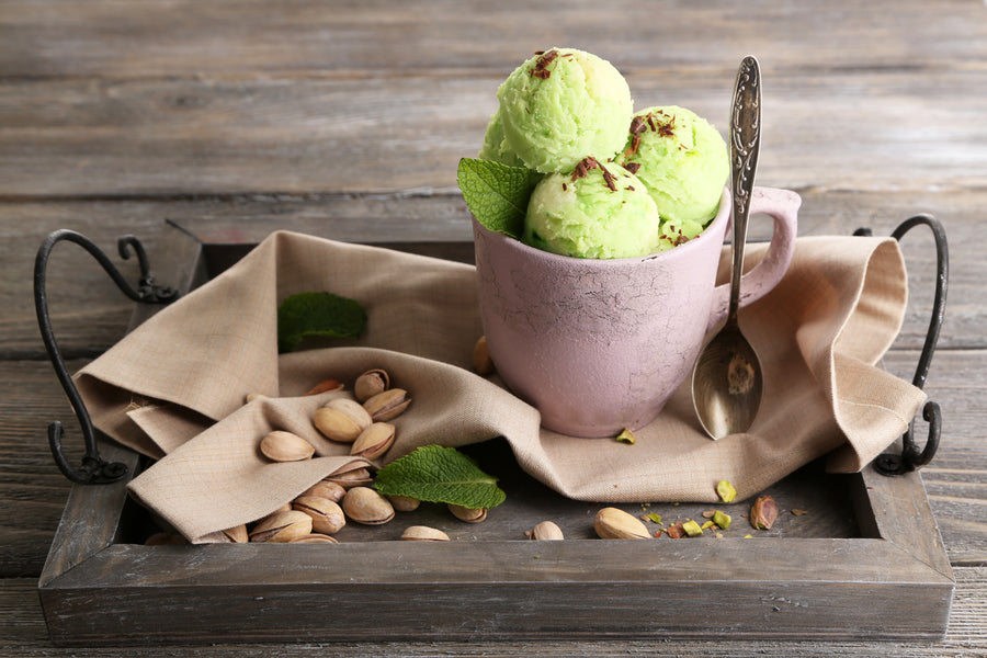 Captivating image of Pistachio Ice Cream: A delightful scoop of velvety goodness adorned with premium pistachios. The image captures the essence of indulgence, inviting you to savor the rich, nutty flavors and creamy texture of our Pistachio Ice Cream.